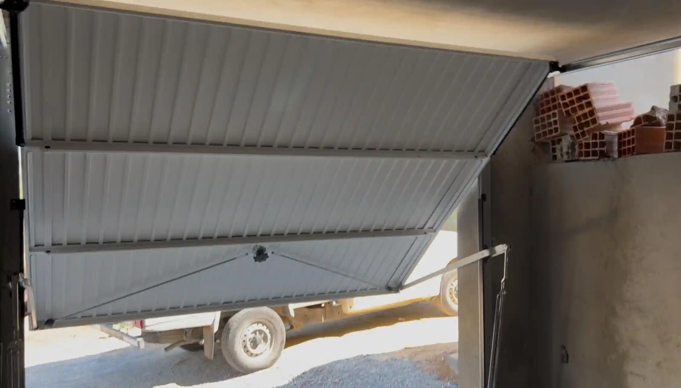 Comment changer ressort porte garage basculante